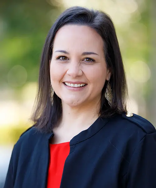 headshot of kim slelton wearing a black dress